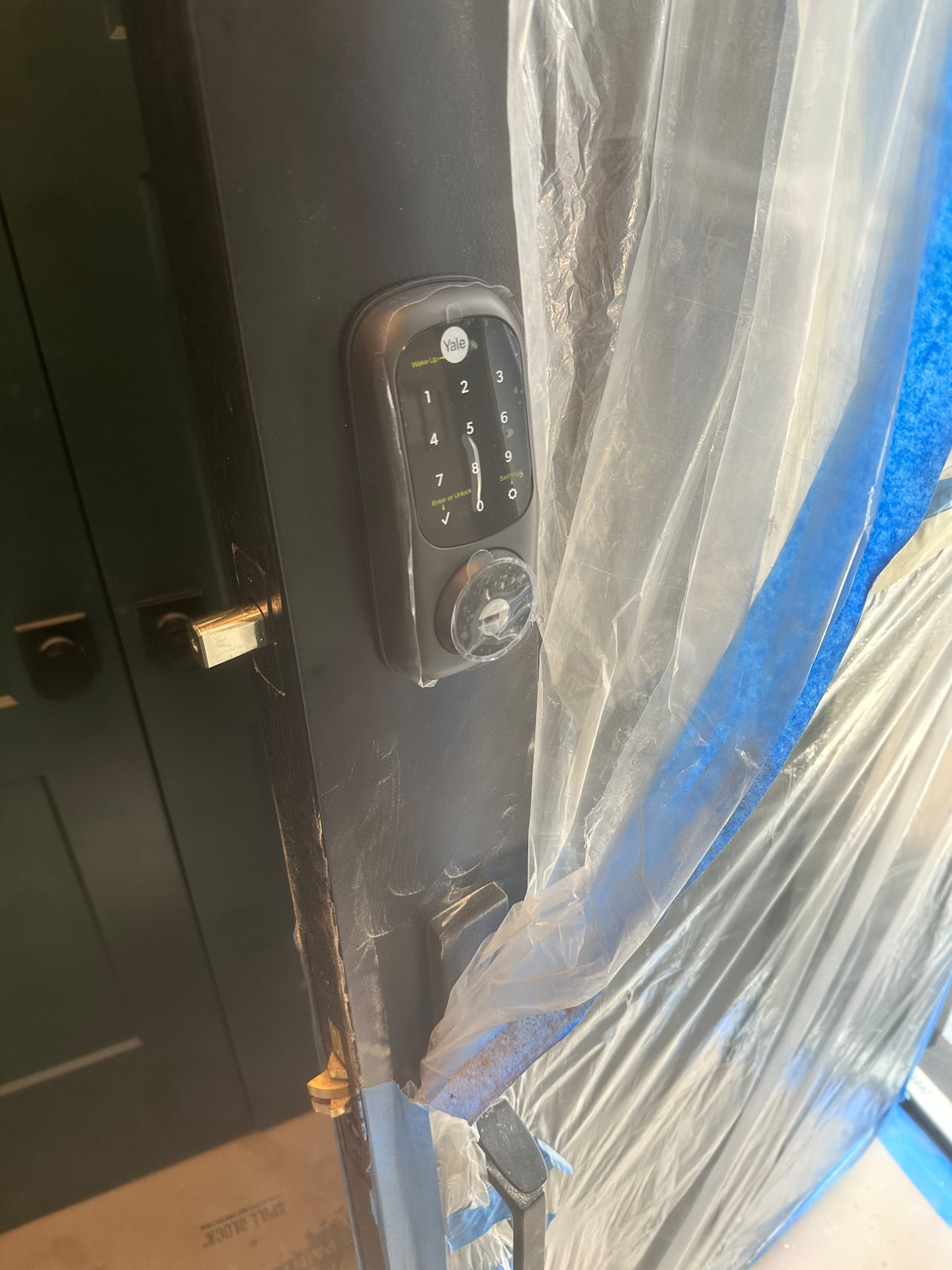 Yale keypad smart deadbolt installed on a residential entry door